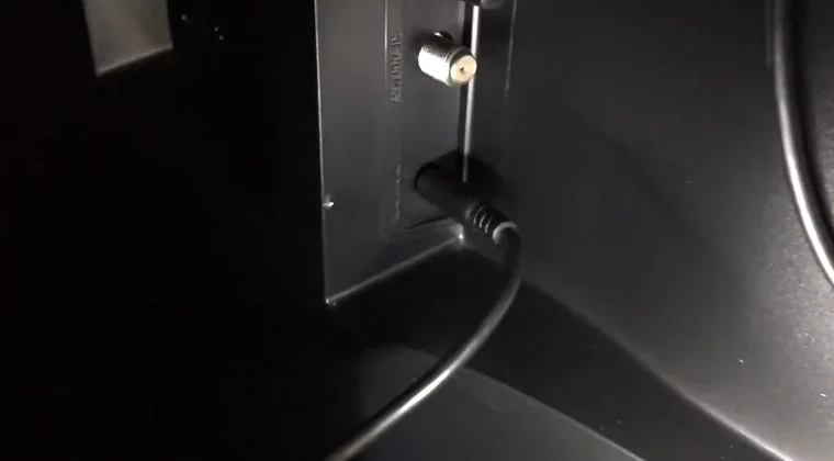 Close-up of the back of a TV showing cable input ports