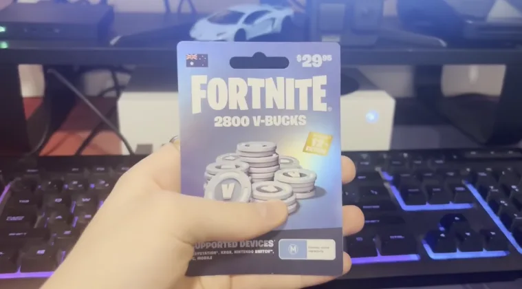 Hand holding 2800 Fortnite V-Bucks