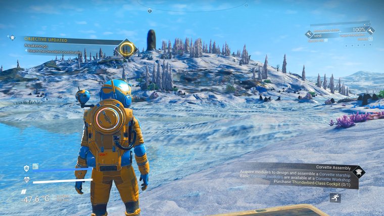 No Man’s Sky character in yellow suit standing on ice.