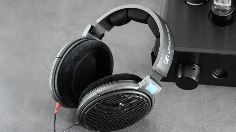 Sennheiser HD 600 headphones on the table with padding visible.