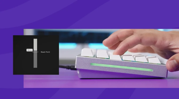 Side view of a keyboard with fingers pressing the keys.