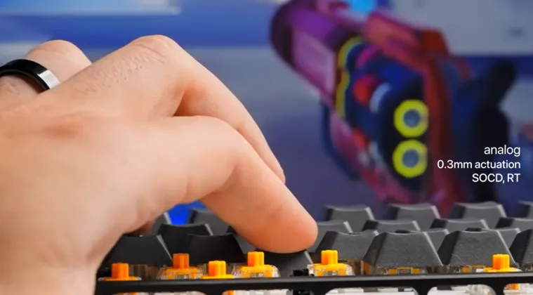 Fingers typing on a keyboard.