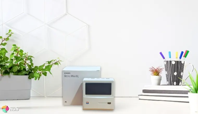AYANEO AM01 Retro Mini PC on a white office desk with natural shadows for a review