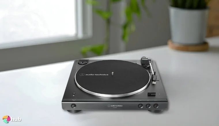 Audio-Technica AT-LP60XBT-BK Turntable on a white office desk with soft lighting for a review