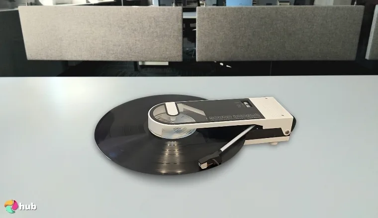 Audio-Technica AT-SB727-YL Vertical Record Player on a white office desk positioned for photography