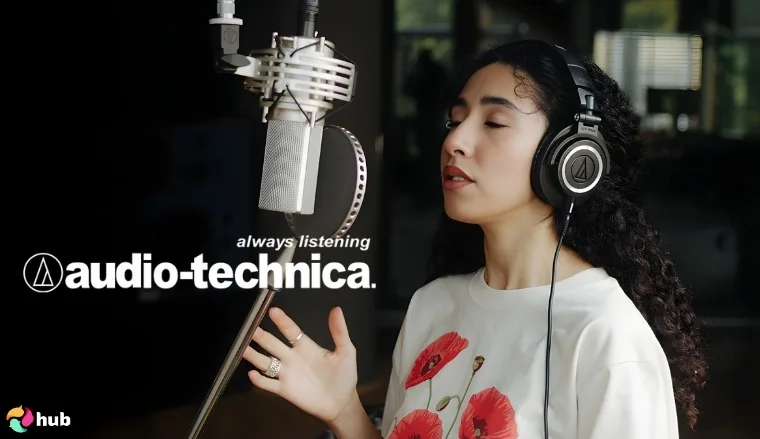 Audio-Technica logo and a young woman wearing headphones with her eyes closed in front of a microphone