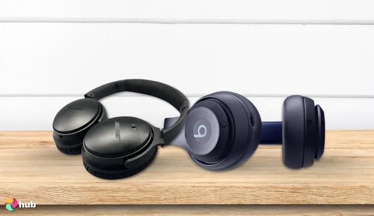 Beats Studio Pro and Bose QuietComfort headphones on the desk