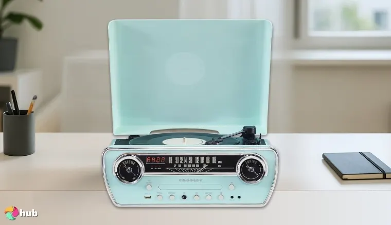 Crosley CR6047A-AB Powel 7-in-1 Record Player on a white office desk with soft lighting for a review
