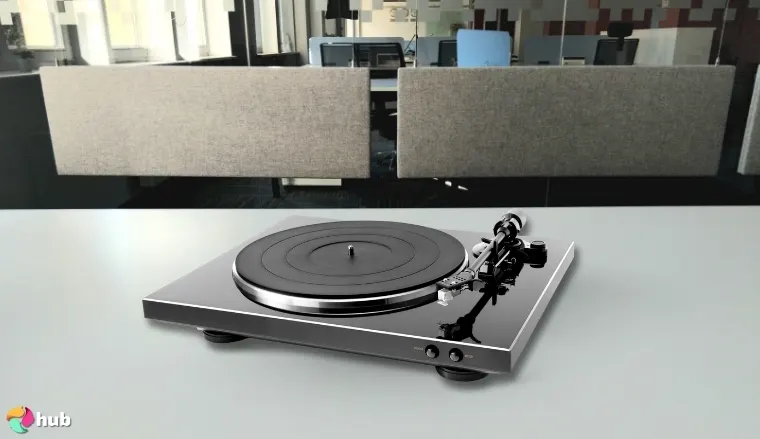 Denon DP-300F Automatic Turntable on a white office desk in a clean setup for a review