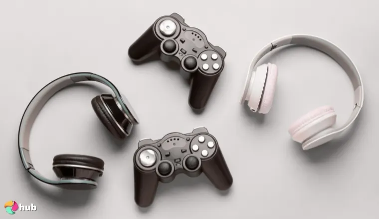 Game controllers and headphones on a gray background