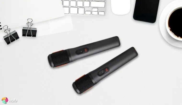 JBL PartyBox Wireless Microphones on a white office desk in close-up for a review