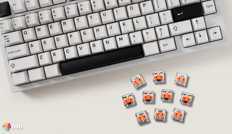 Kailh Choc V1 Red Low-Profile Switches on a white office desk in a top-down view for a review