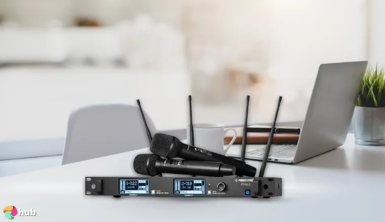 Phenyx Pro Wireless Microphone System on a white office desk in a bright workspace for a review