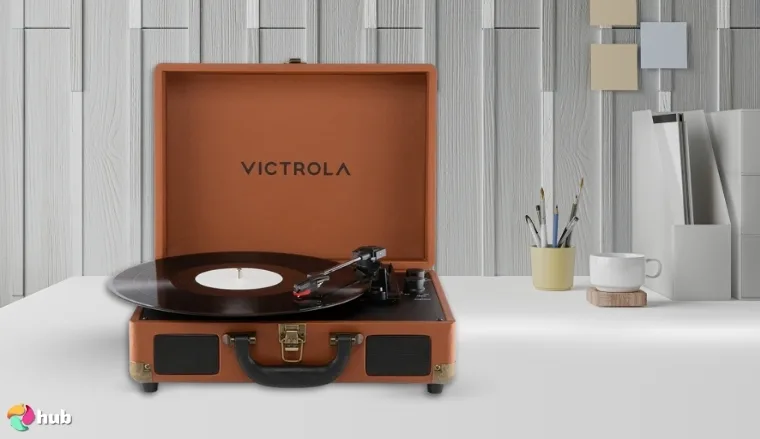 Victrola Journey II Suitcase Turntable on a white office desk with an editorial style for a review
