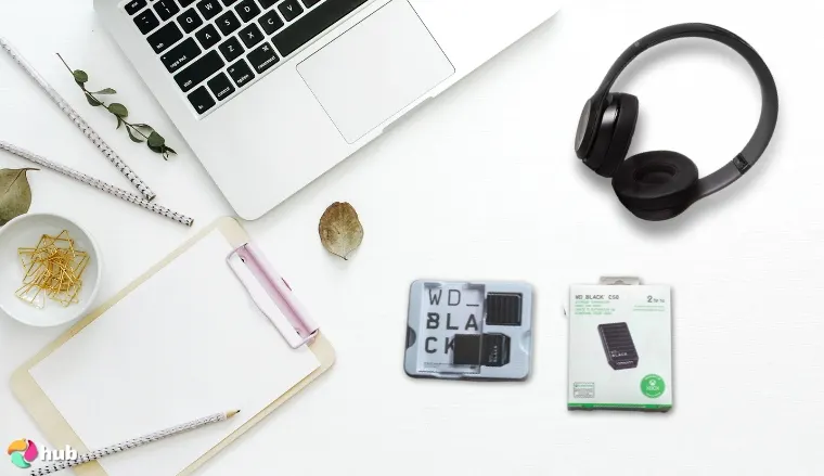 WD_Black C50 Storage Expansion Card on a white office desk with creative arrangement for a review