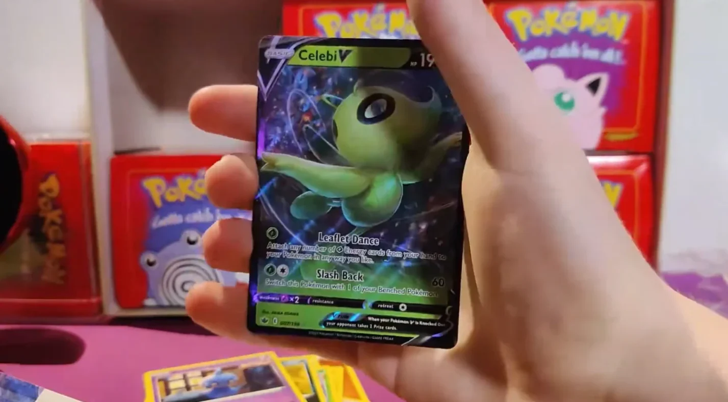a Pokemon card in the hand