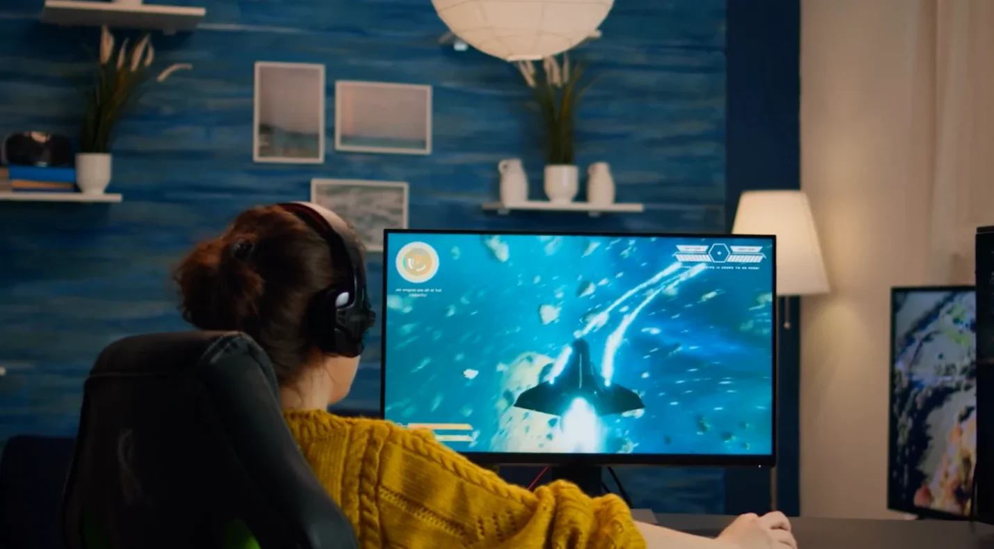 A woman playing games on the computer