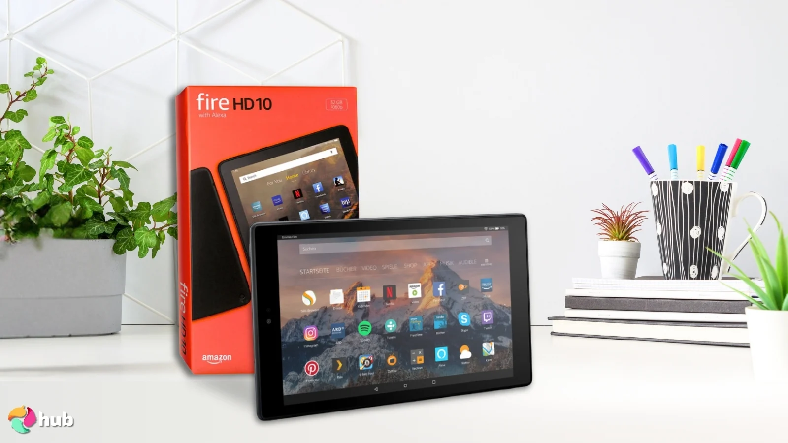 Amazon Fire HD 10 tablet on a white office desk styled for a review