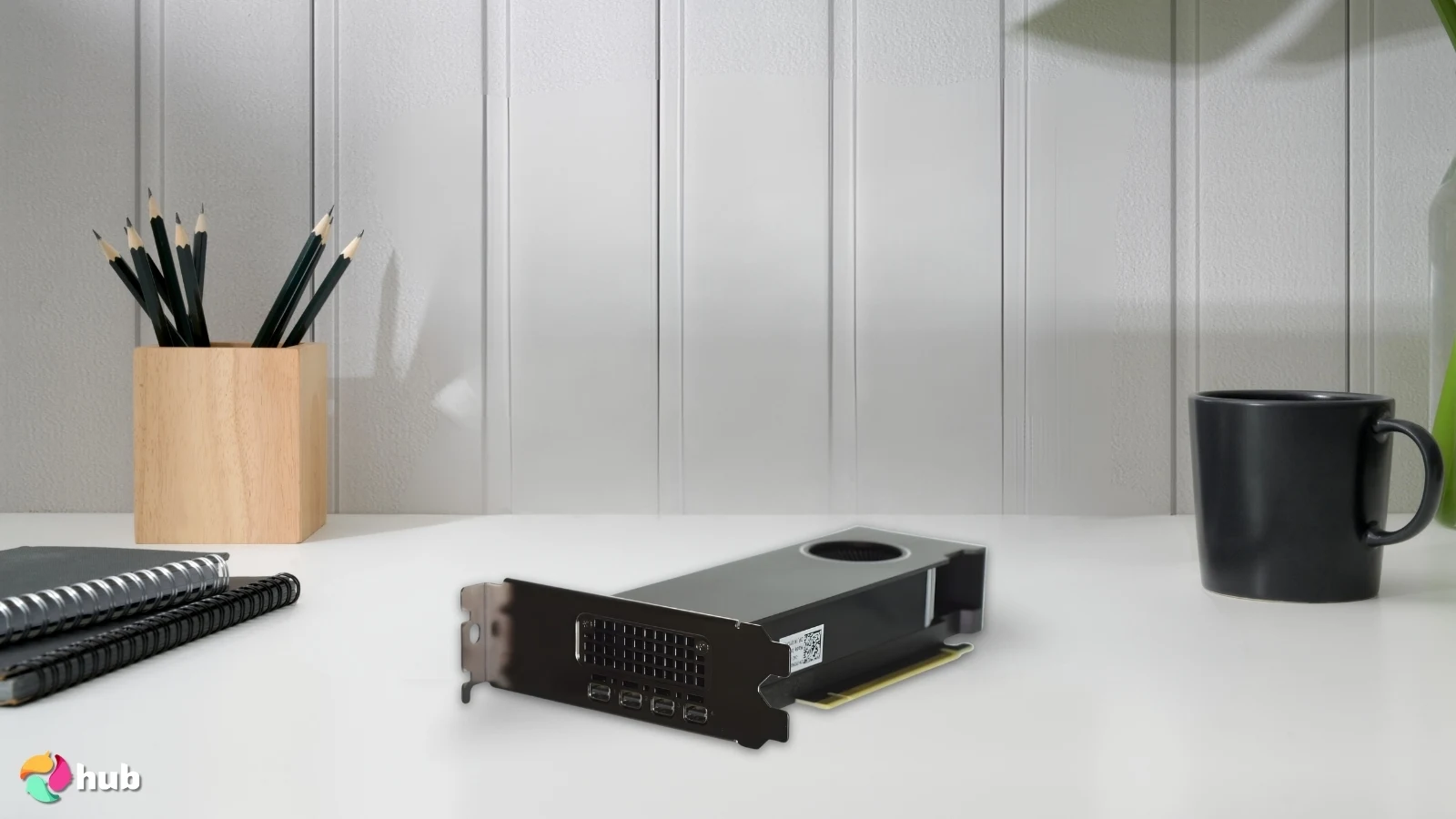 PNY NVIDIA RTX A2000 Low Profile GPU on a white office desk with soft lighting for a review