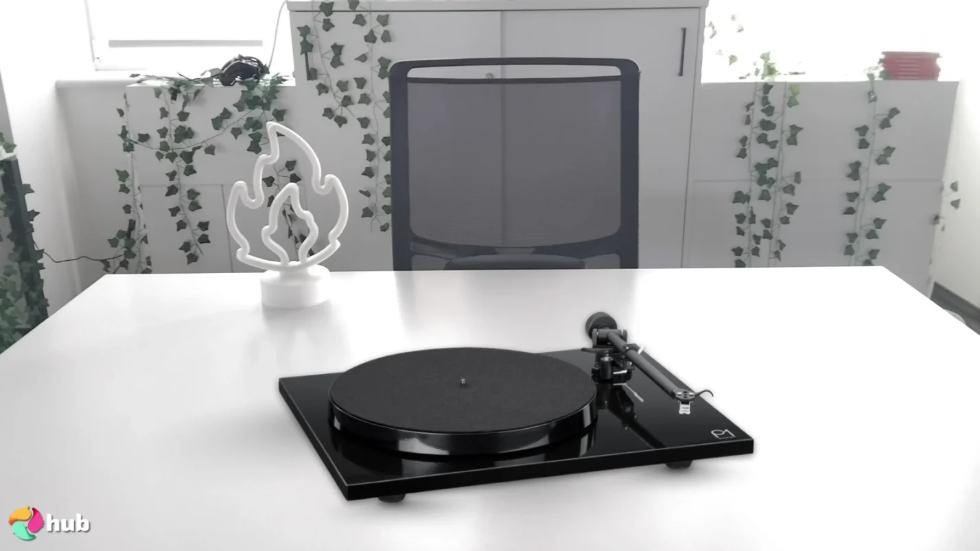 Rega Planar 1 turntable on a white office desk with simple styling for a review