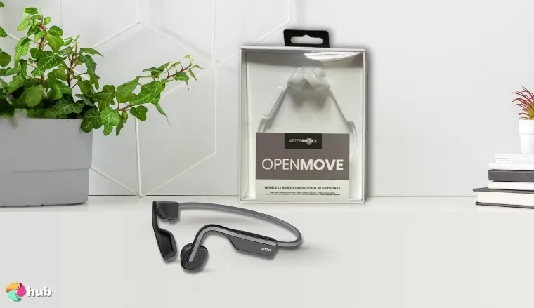 Shokz OpenMove Open-Ear Headphones on a white office desk positioned for photography