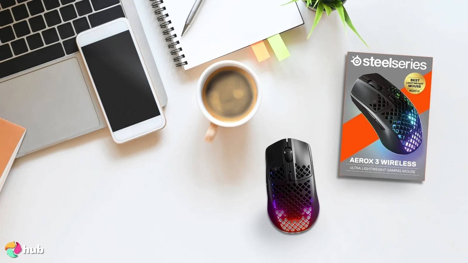 SteelSeries Aerox 3 Wireless Mouse on a white office desk positioned for photography