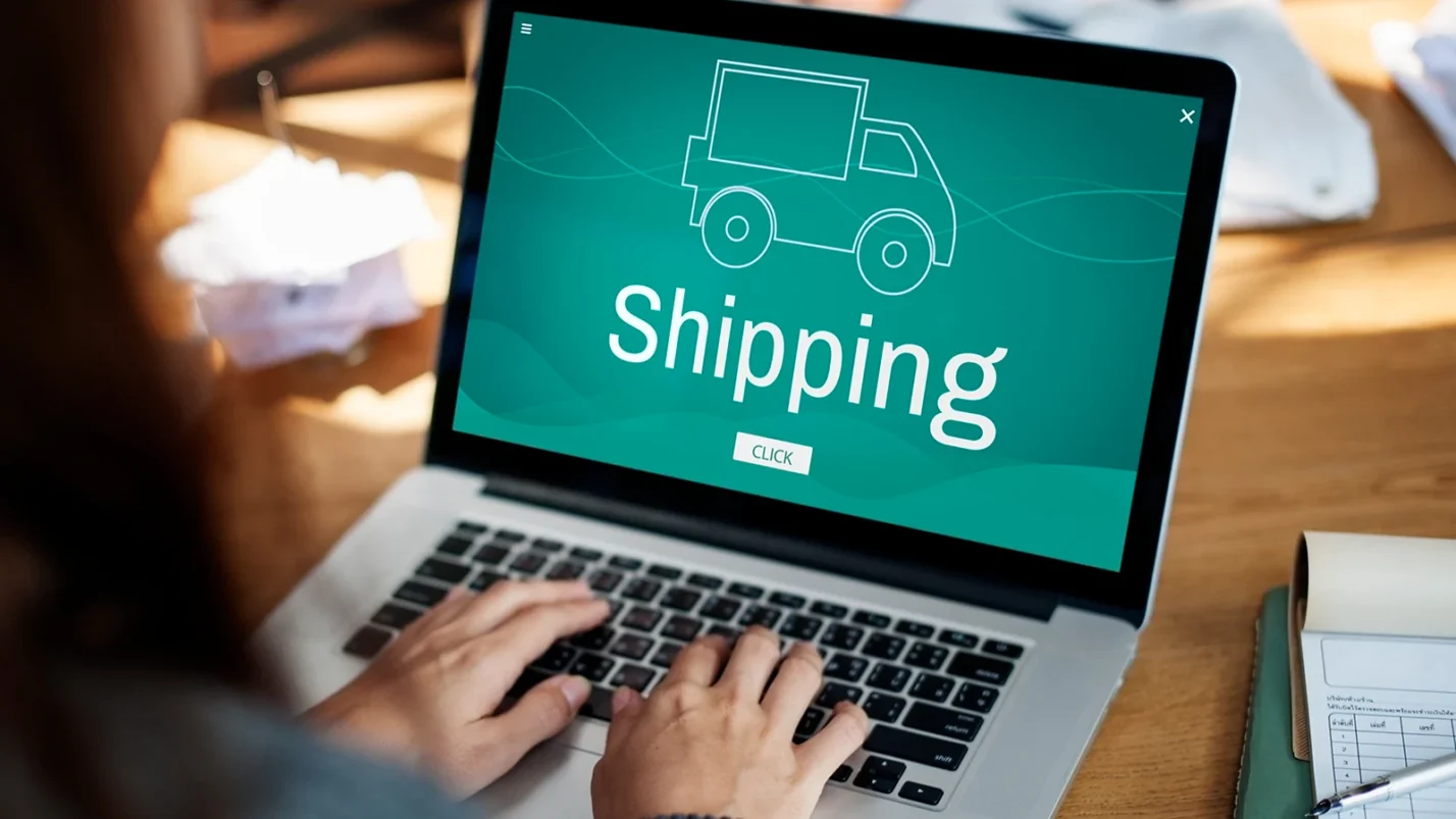 Laptop with text Shipping