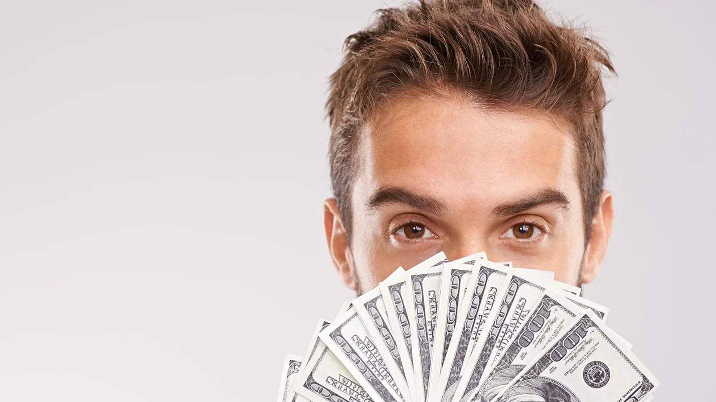 man covered half of his face with money 