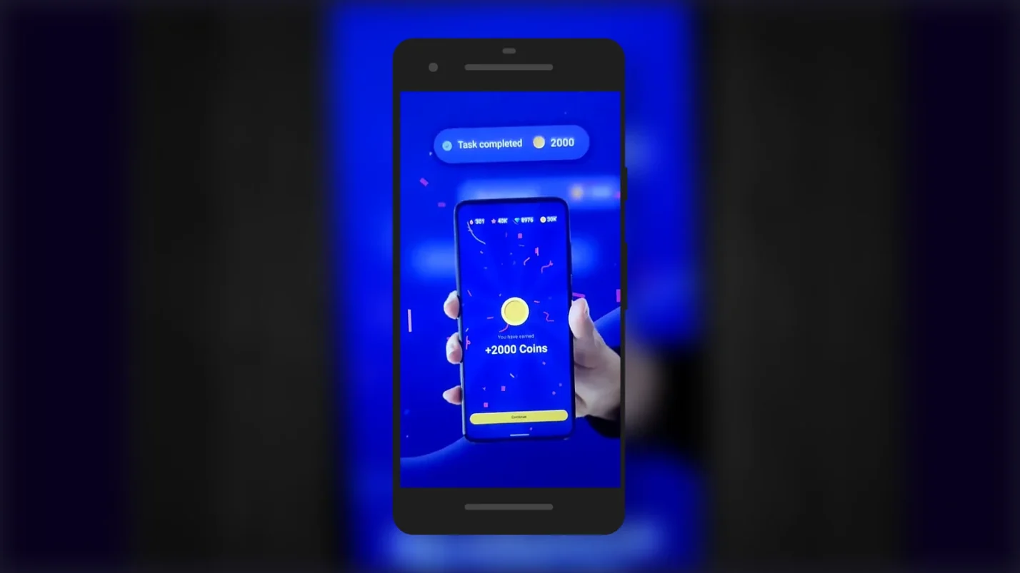 Mobile phone displaying earned coins in Snakzy