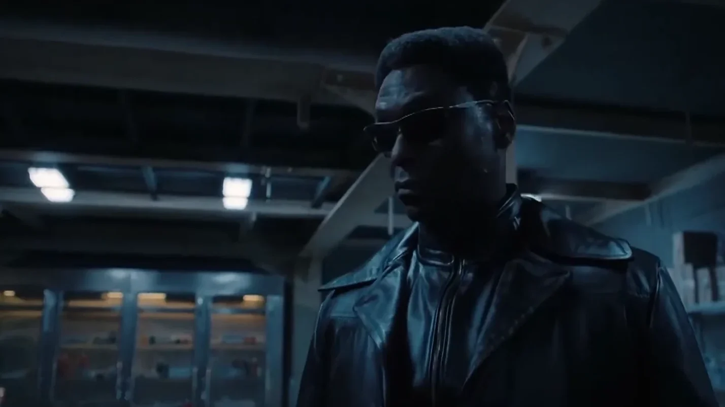 Albert Wesker in black outfit wearing black glasses