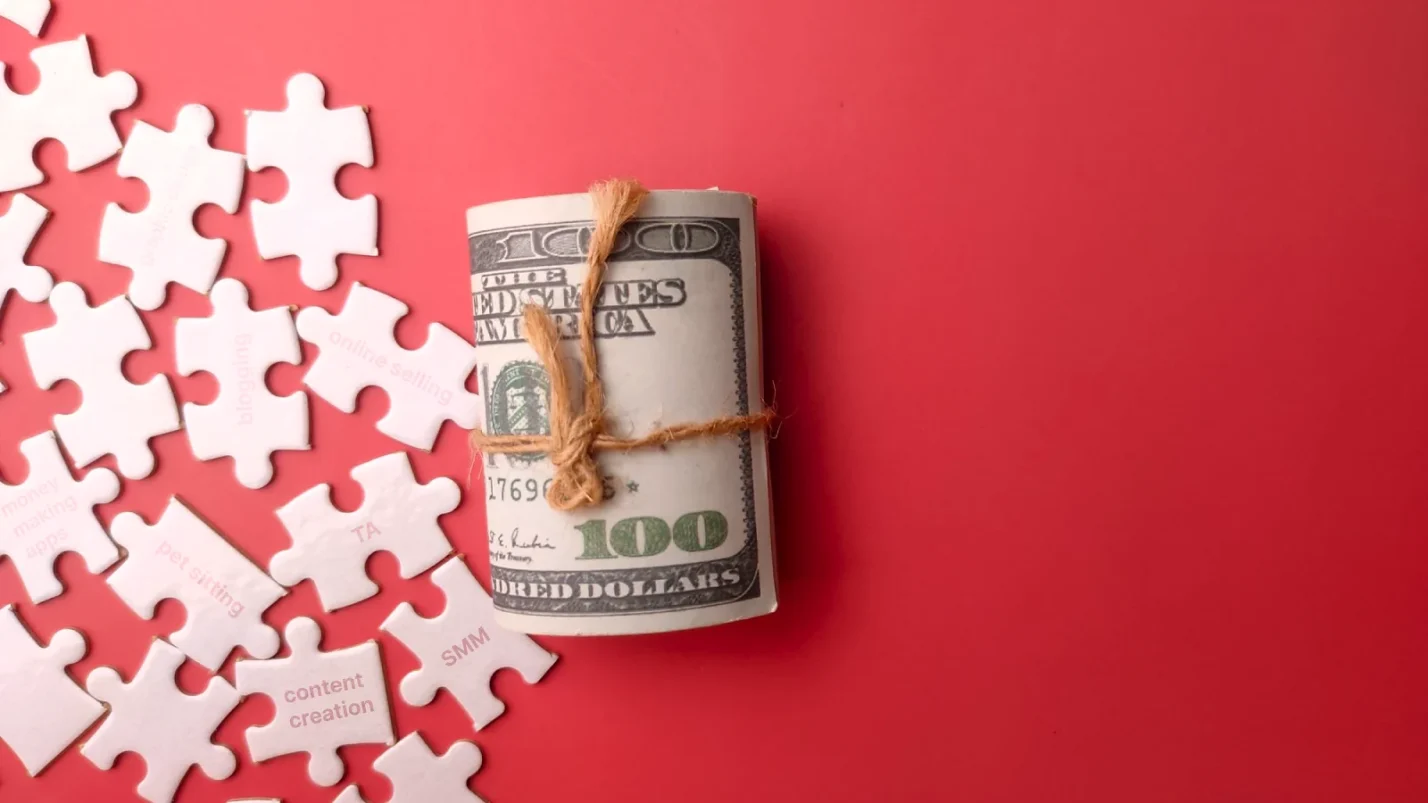 A pack of dollars with puzzles on the table