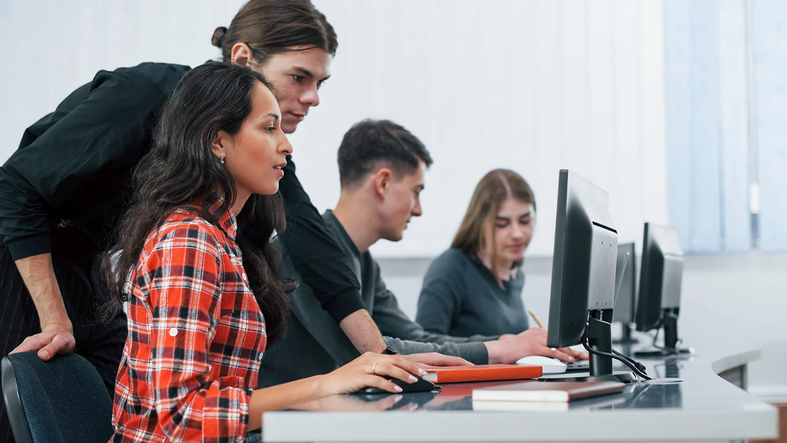 Class of students working on computers