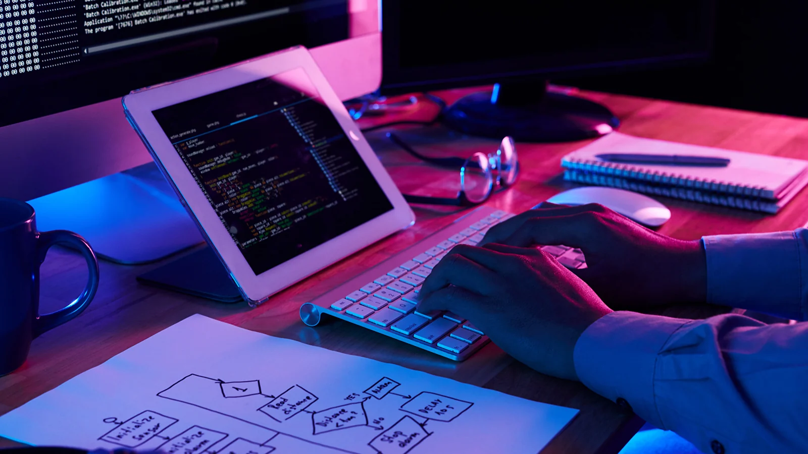 man typing on a laptop