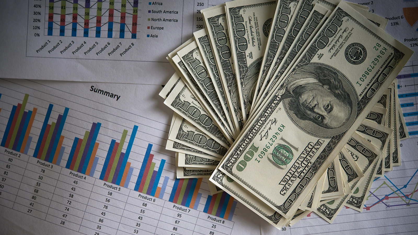 Dollars on top of notes with a diagram