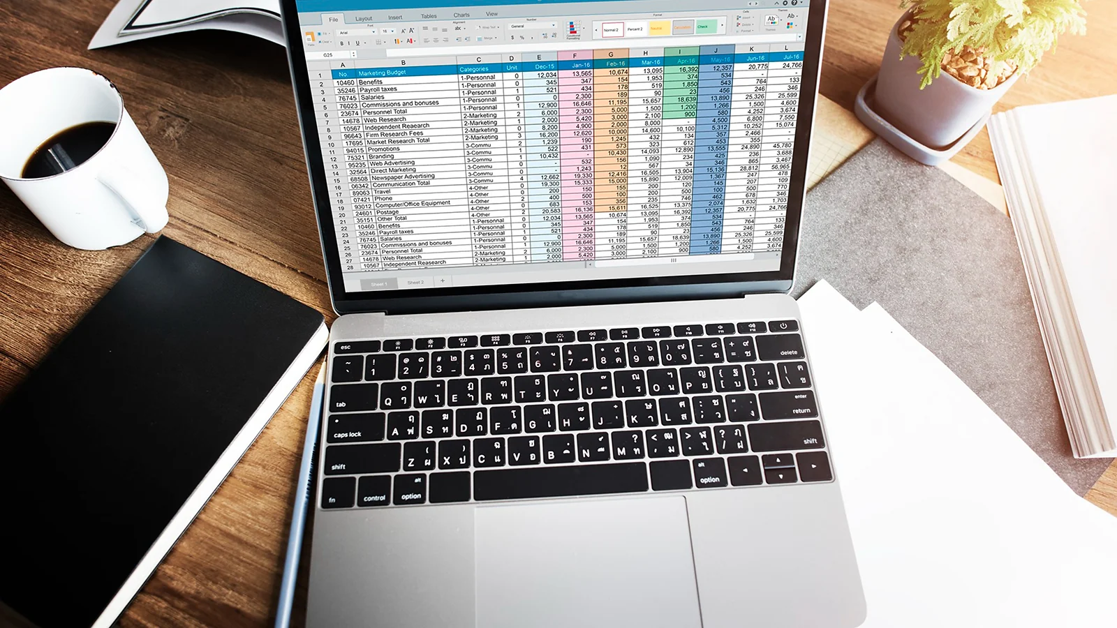 A laptop with an Excel spreadsheet open on the screen