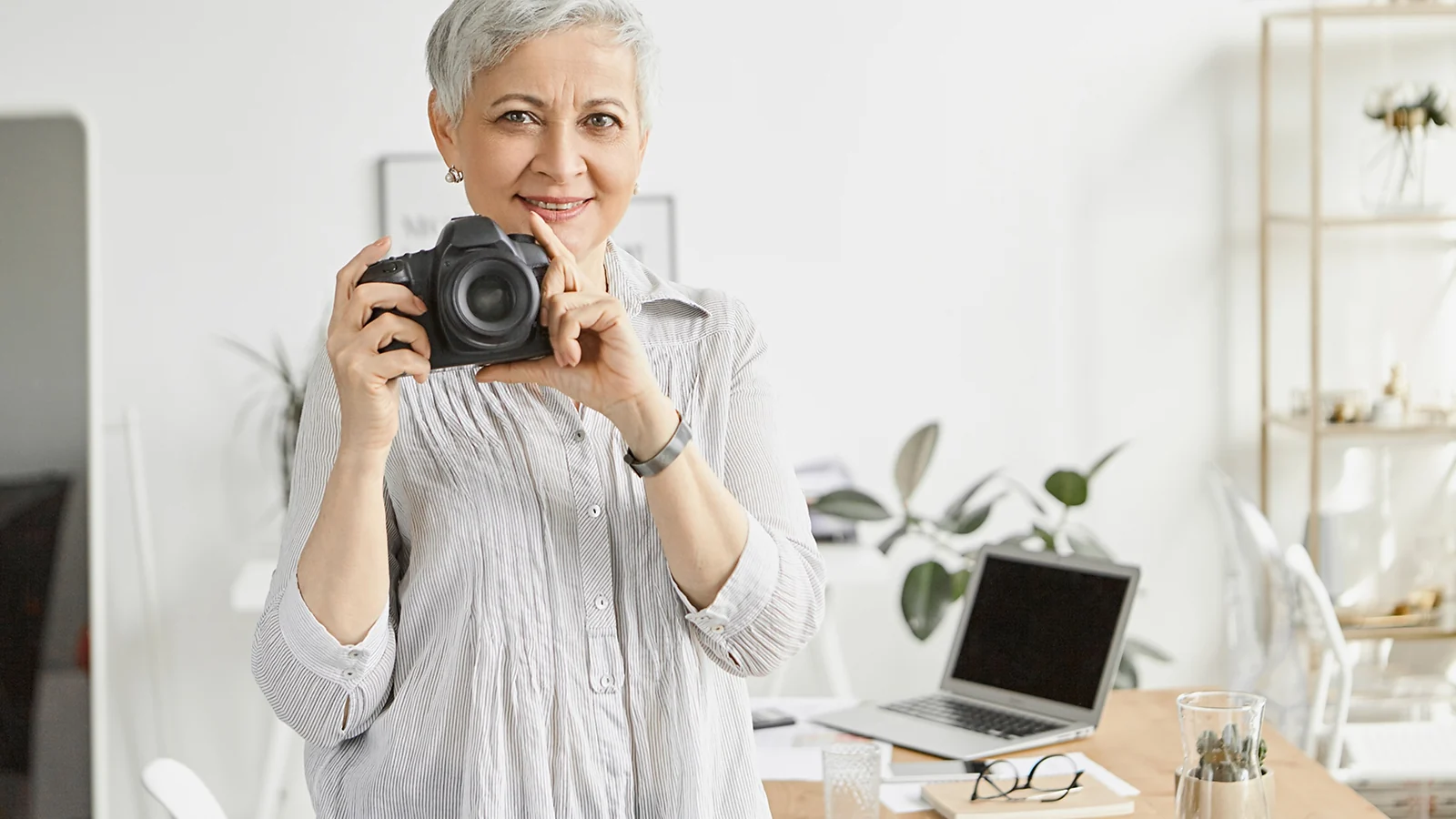 A woman holding a camera