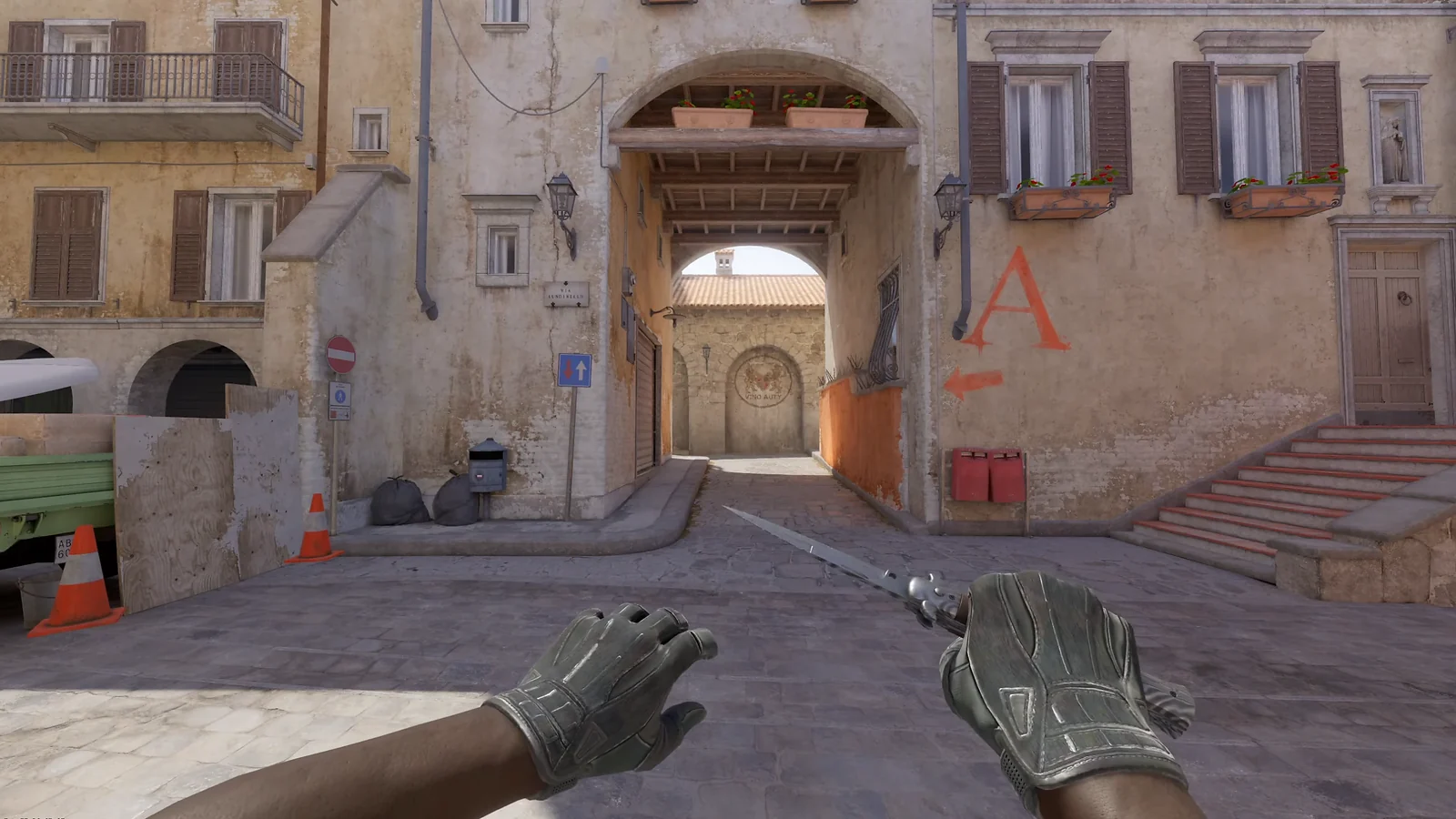 CS2 Sport Gloves Nocts paired with a Butterfly Knife on Inferno