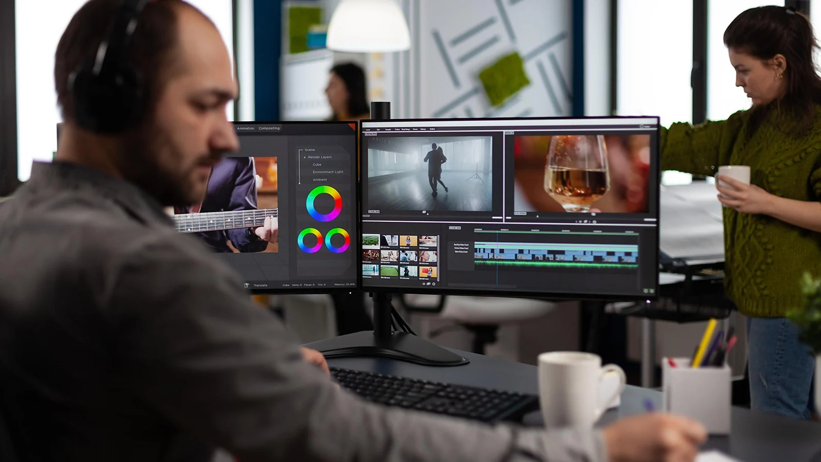 Man sitting in front of computer editing a video