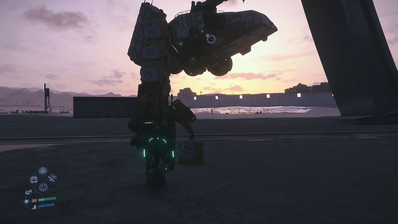 A giant mechanical walker, the DHV Magellan, standing at a port during sunset in Death Stranding 2