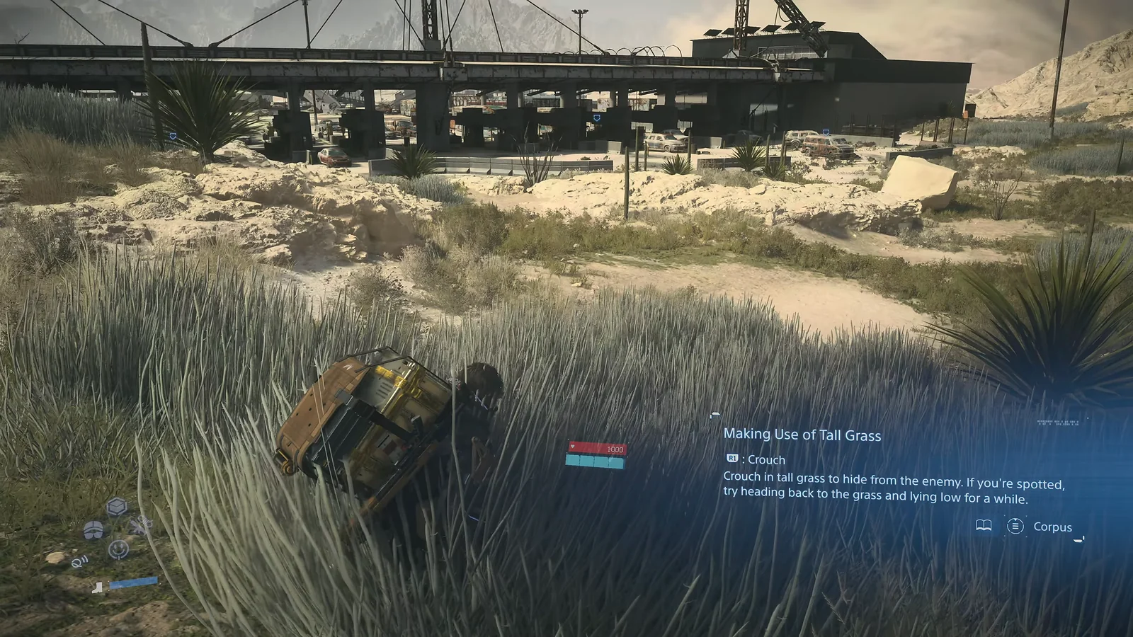 Sam crouching in tall grass with a stealth tutorial overlay in Death Stranding 2