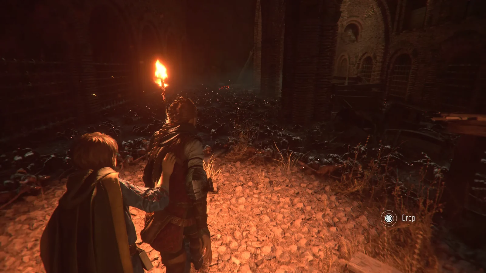 Medieval Action-Adventure: Amicia and Hugo using a torch to repel rats in A Plague Tale: Requiem