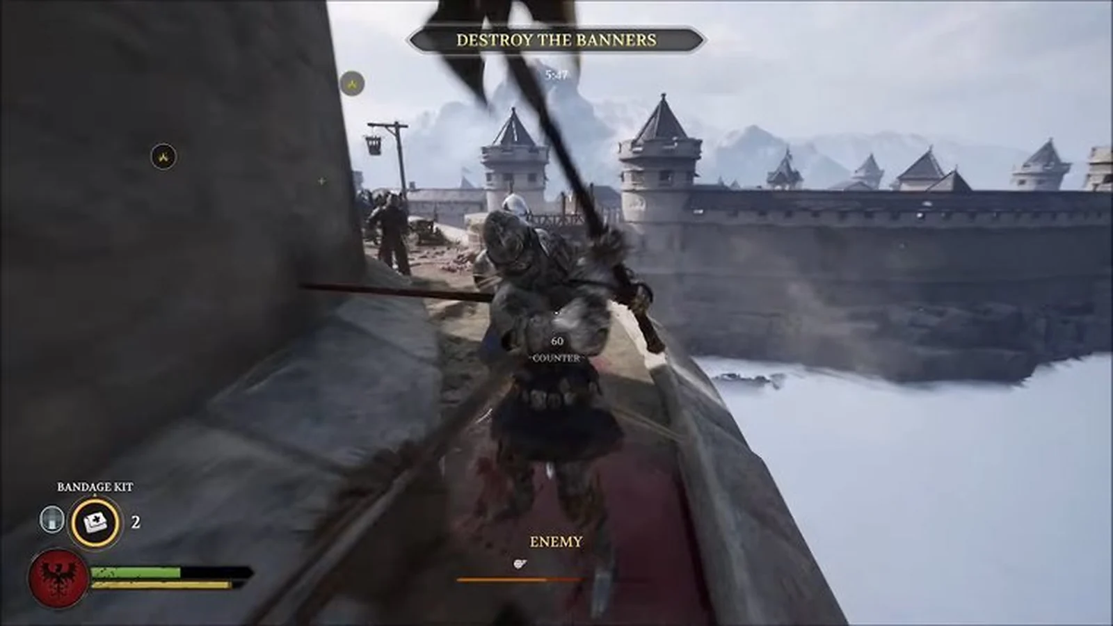 A warrior fighting an armored opponent on a castle wall while the Destroy the Banners objective is active