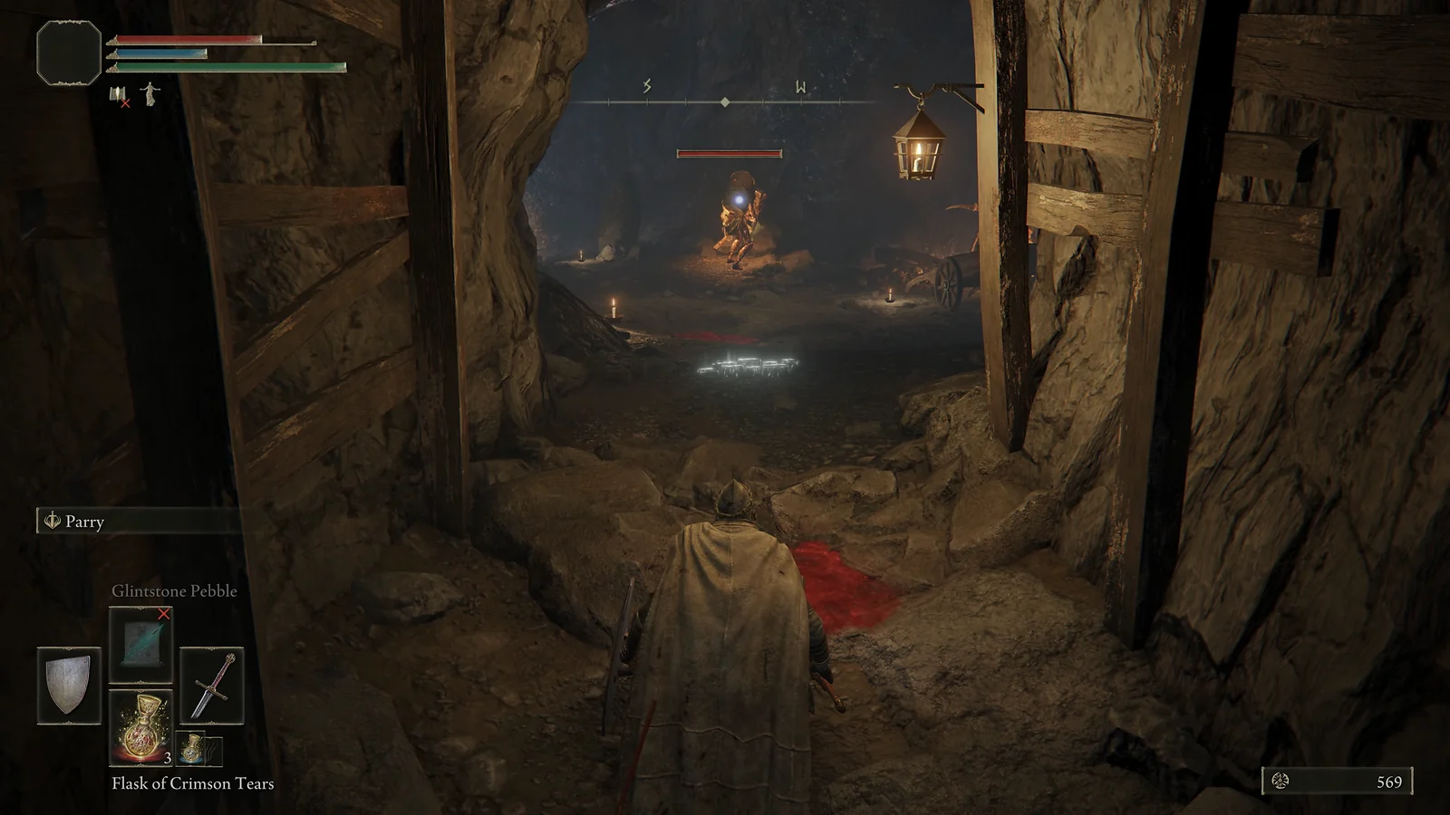 Medieval Action RPG: Approaching a mining enemy in a dark tunnel in Elden Ring