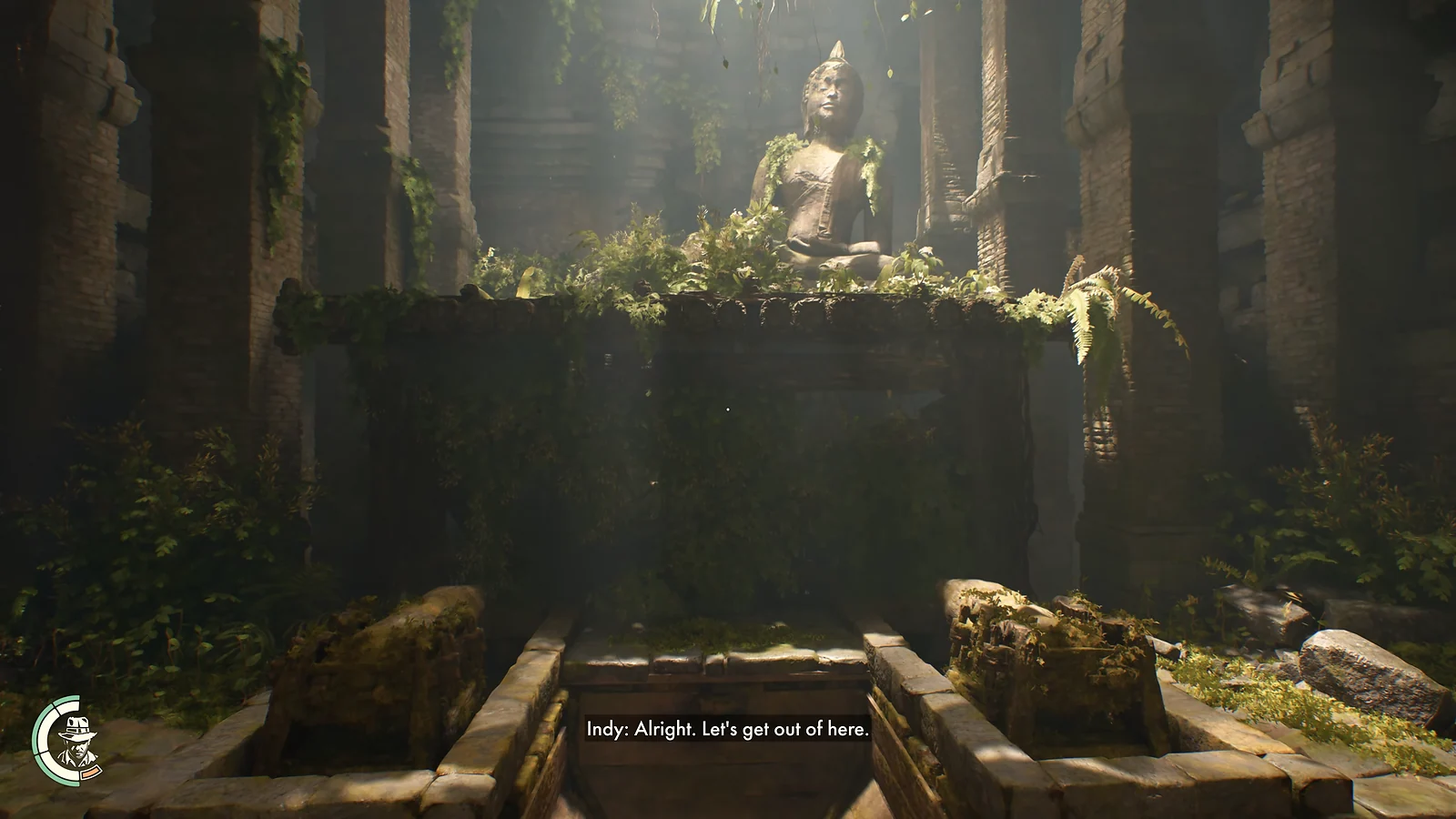 An overgrown ancient temple with a Buddha statue in Indiana Jones and the Great Circle
