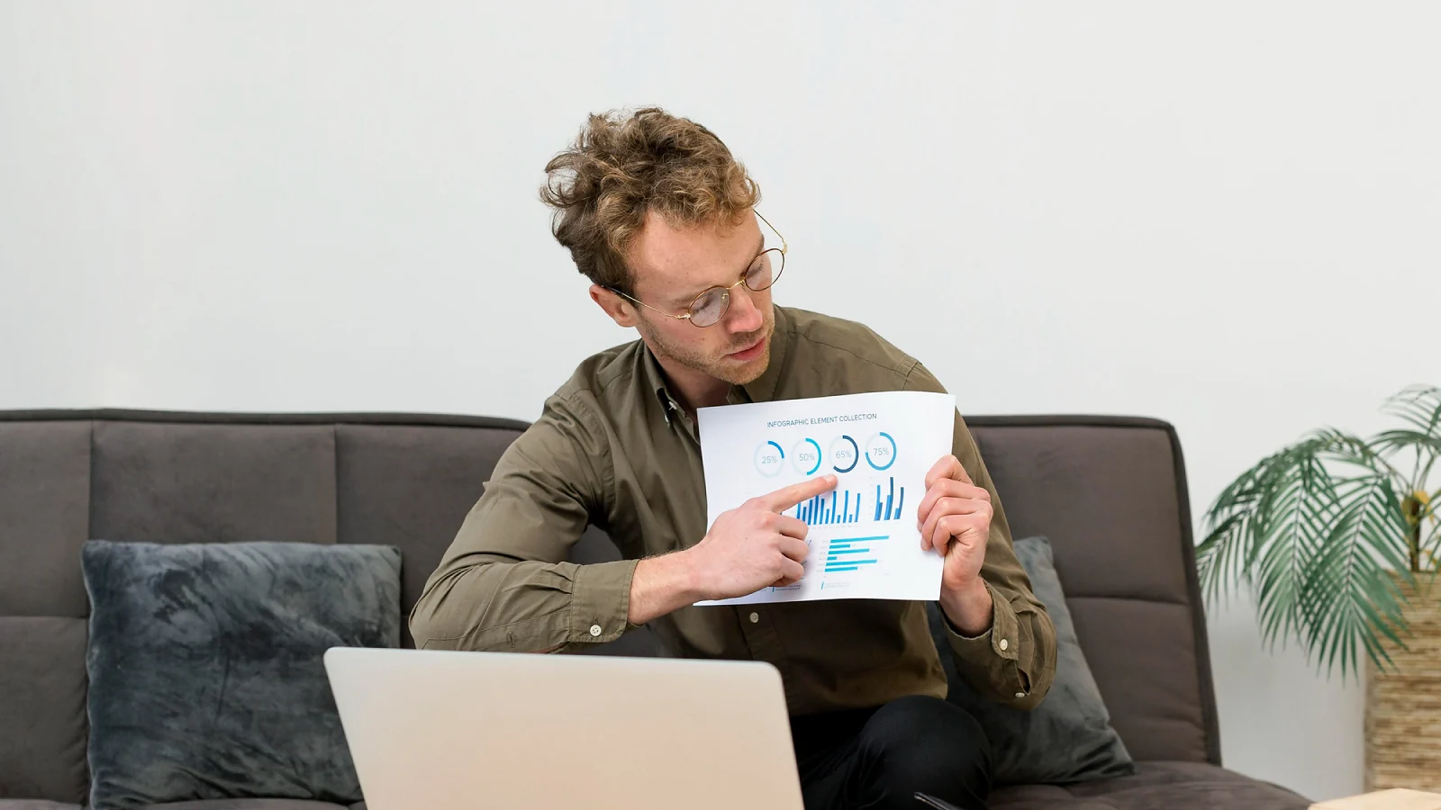 a man pointing to the infographics