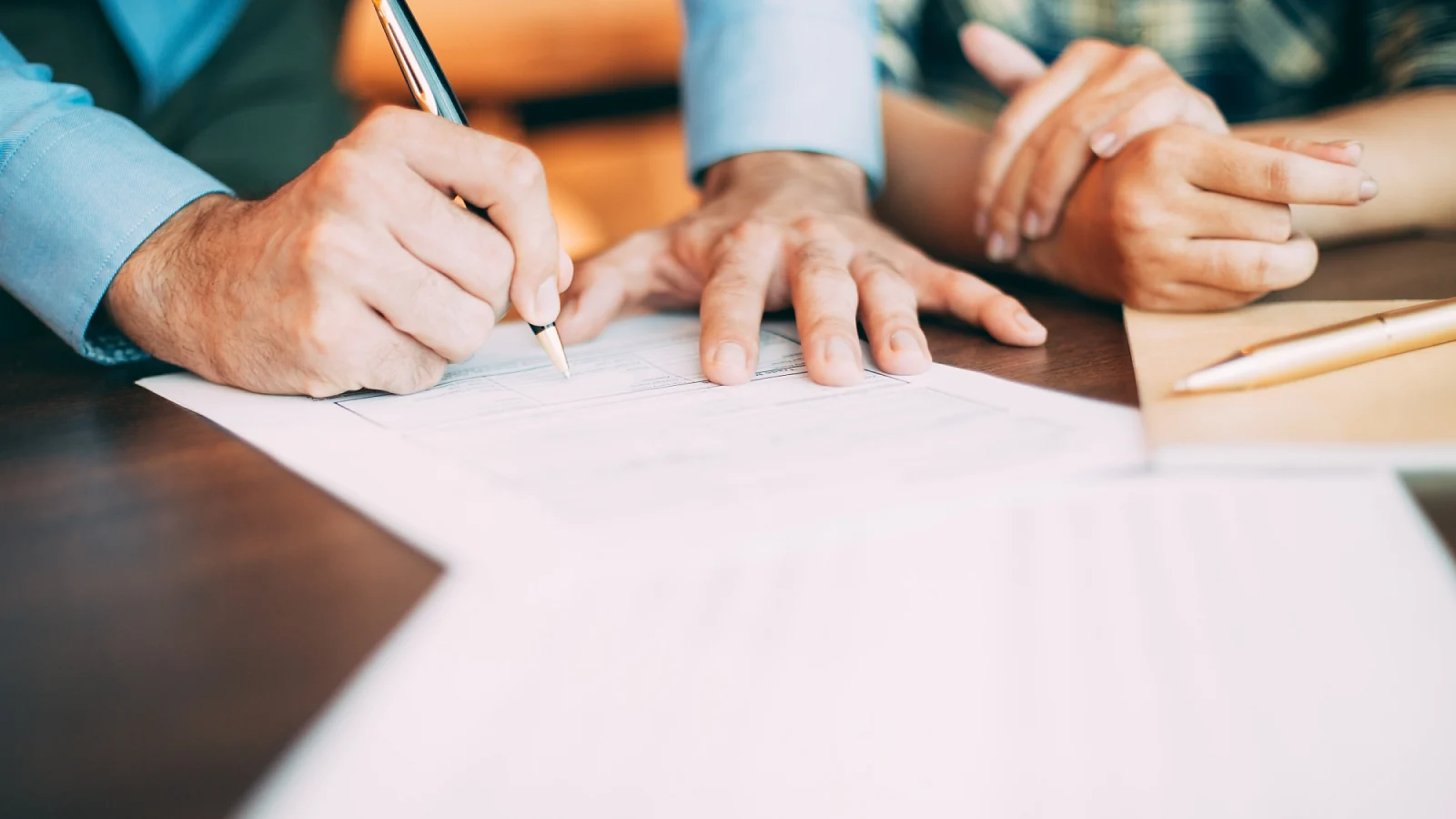 a man signing a contract