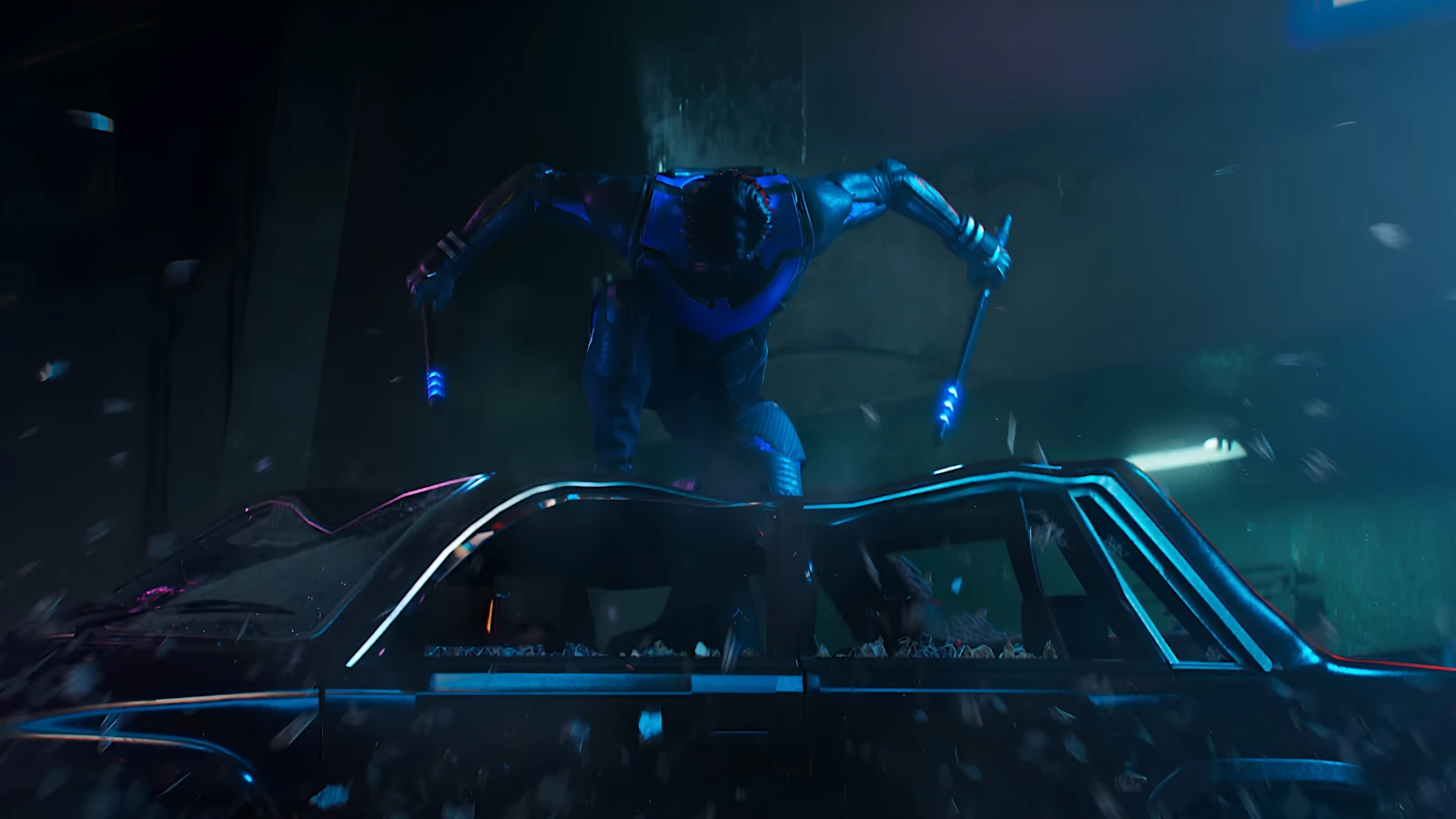 A Gotham Knights hero standing on a car during a street encounter