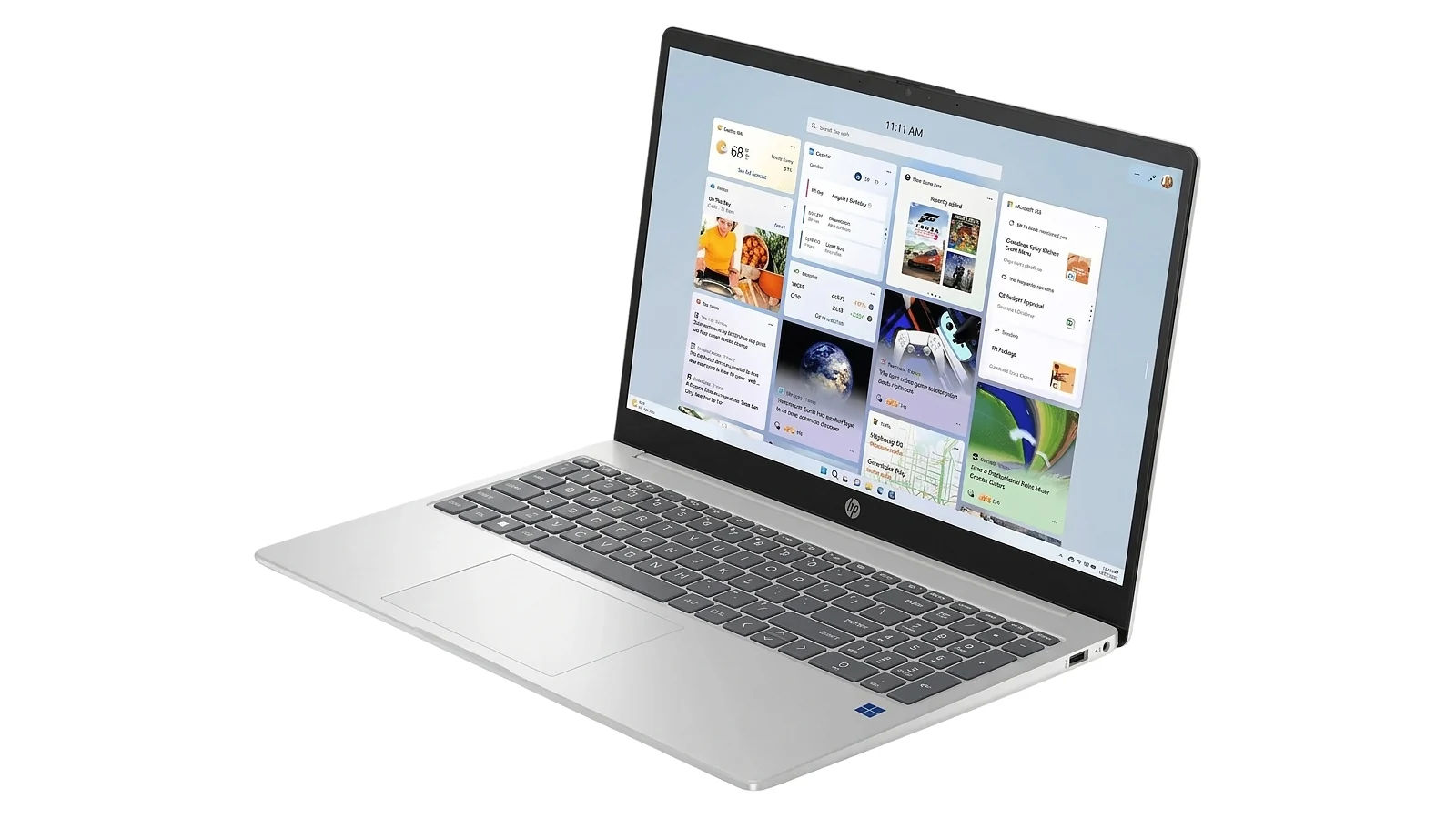 HP Laptop 15 angled view on white background with Windows 11 home screen displayed on the 15.6-inch panel