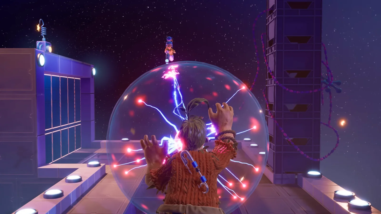Cody's electric shield ability protecting May during a co-op puzzle in It Takes Two