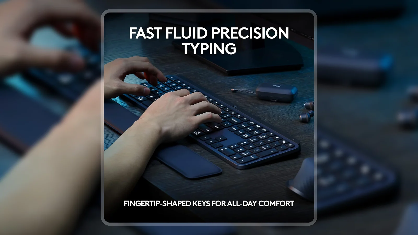 Hands typing on the Logitech MX Keys S Wireless Keyboard on a dark desk with earbuds nearby
